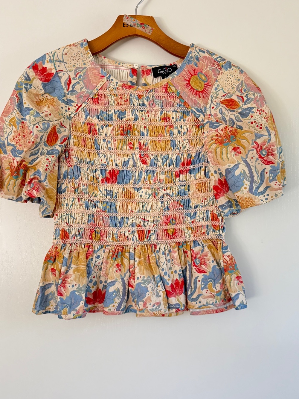 Gigio Smocked Floral Peplum Blouse in Multi-Color